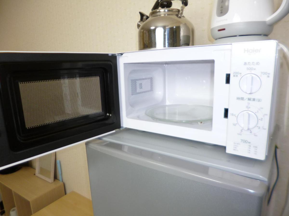 Ferienwohnung ザミッキーカールトン井尻102 Shiobaru Exterior foto