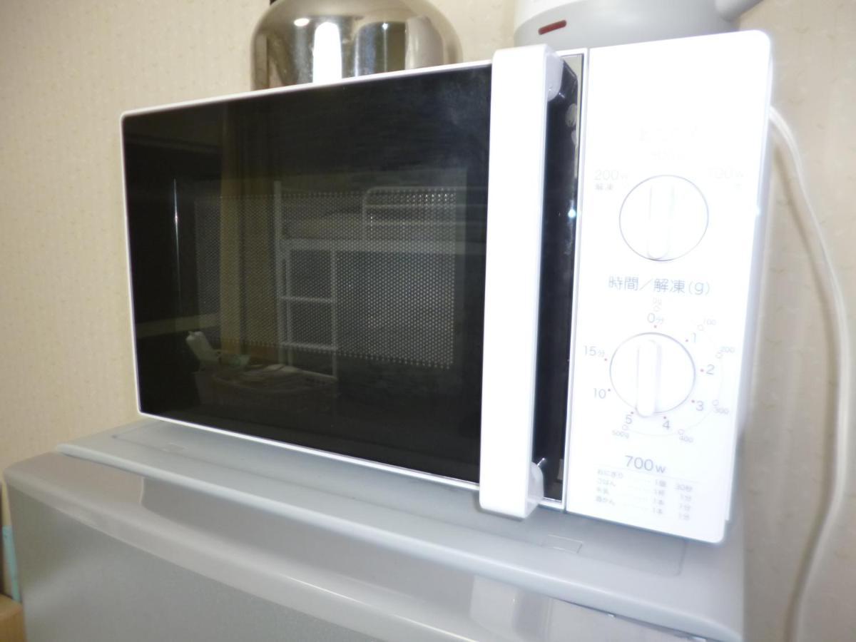 Ferienwohnung ザミッキーカールトン井尻102 Shiobaru Exterior foto
